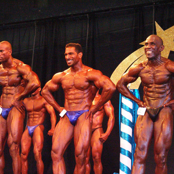 Competitors on stage at a bodybuilding show