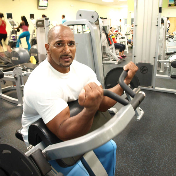 A member training on a seated machine